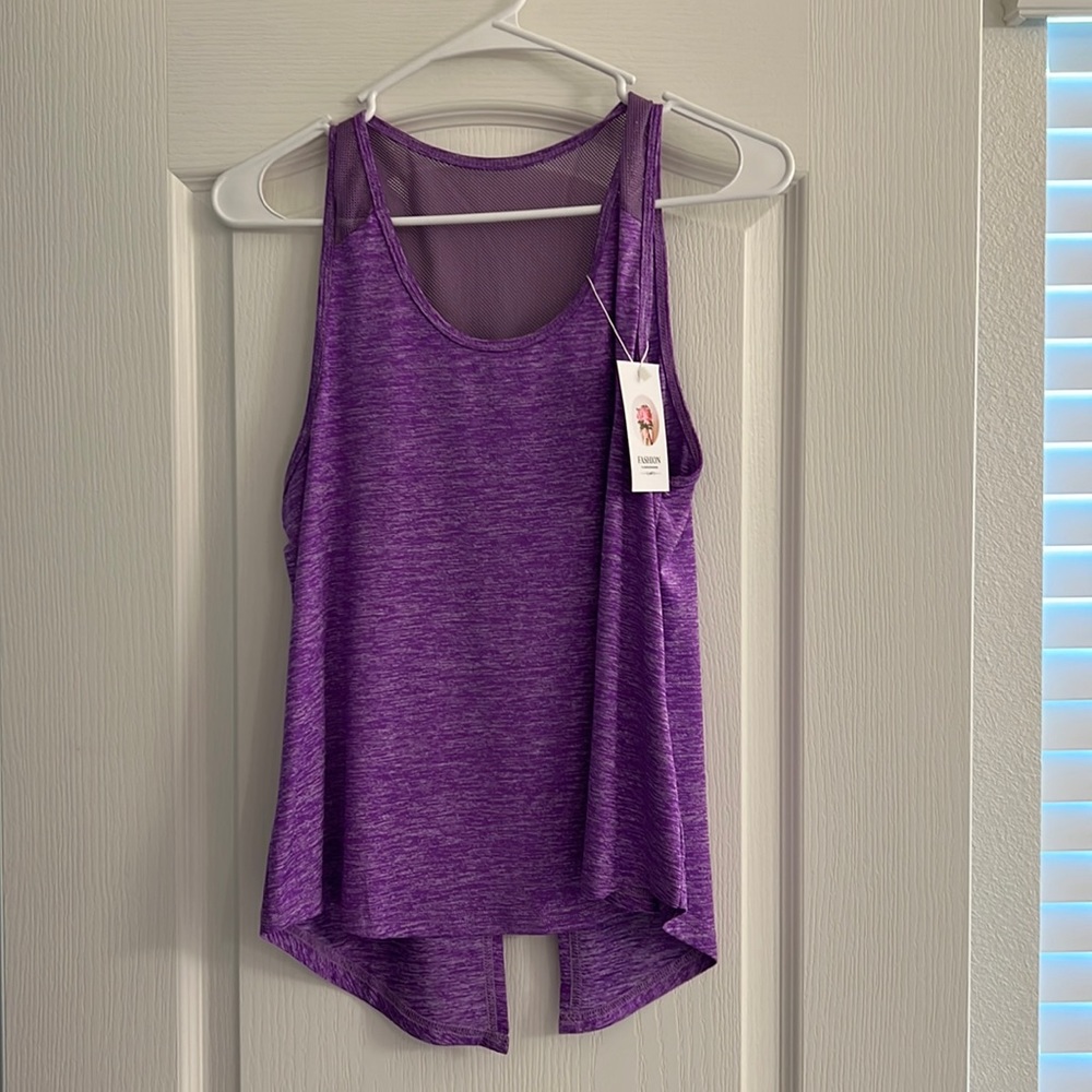 Purple workout top. Split back. New with tags. Small.